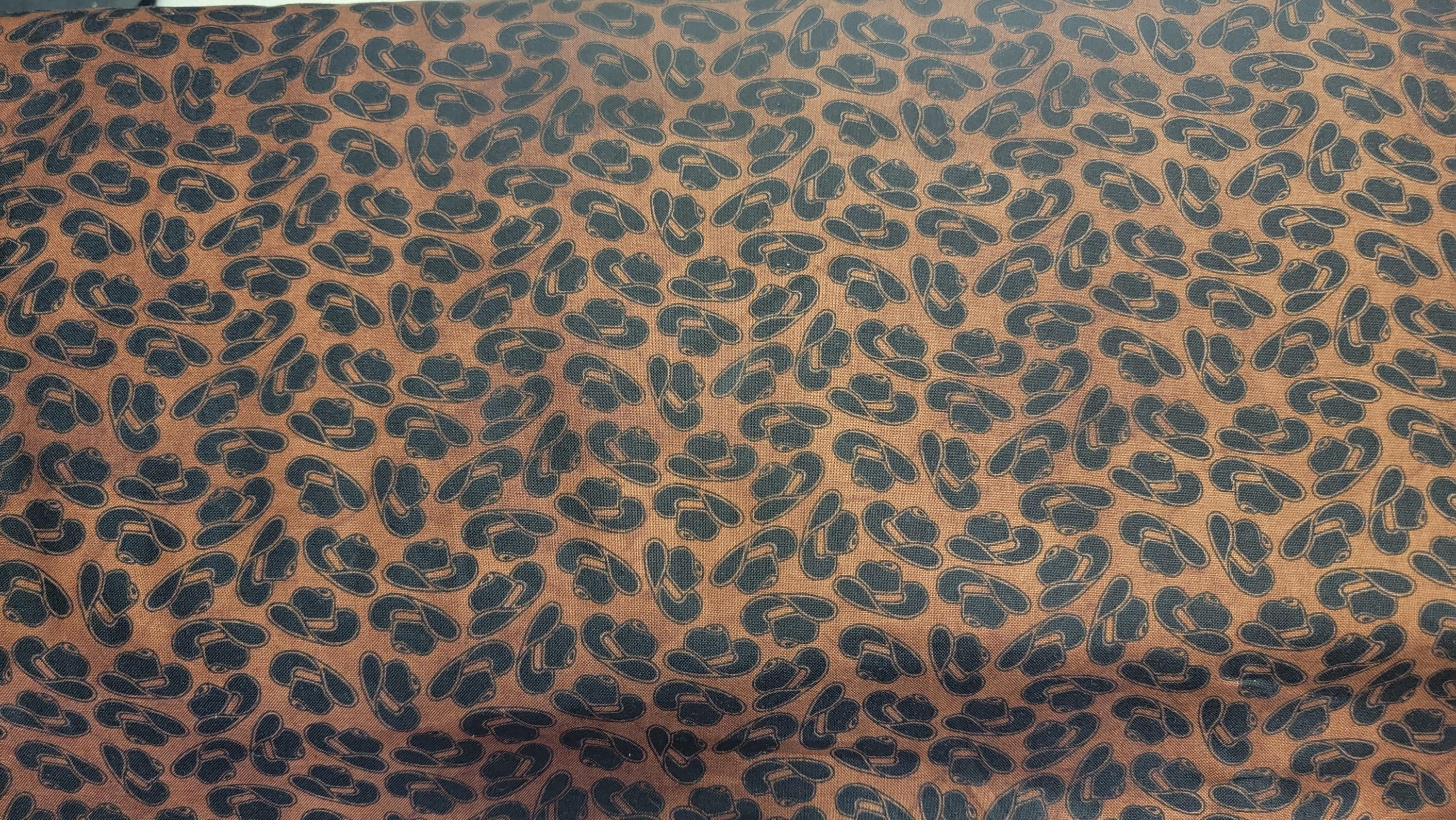 Western Essential Cowboy Hats Brown background Quilt Fabric by Blank Quilting