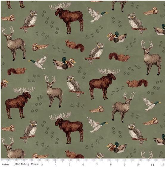Whispering Pines Forest Animals Toss Green Quilt Fabric By Riley Blake Designs.